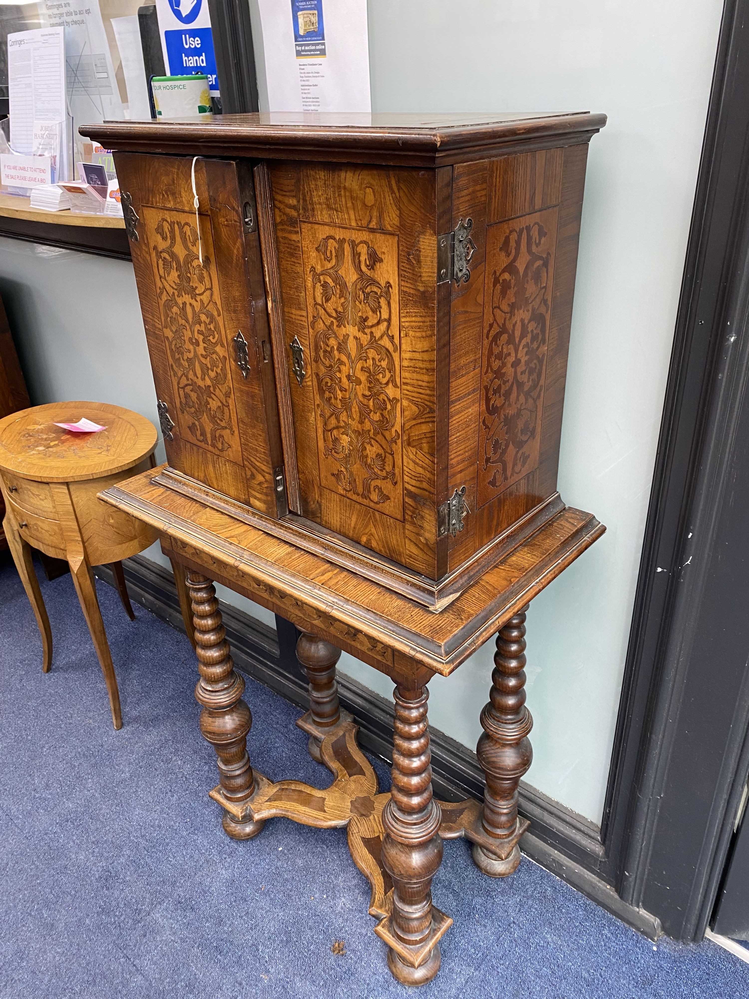 A Continental marquetry cabinet on stand, width 65cm, depth 36cm, height 126cm